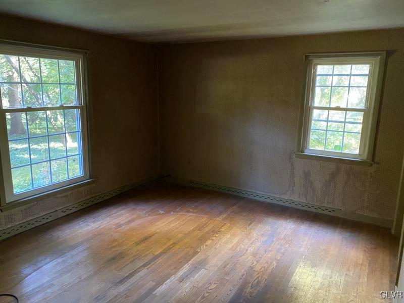 1029 Westgate Circle Bethlehem, PA 18017 - Photo 28 of 42 an empty room with wooden floor and windows