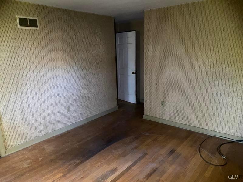 1029 Westgate Circle Bethlehem, PA 18017 - Photo 30 of 42 an empty room with wooden floor