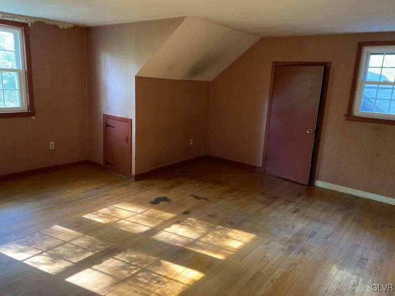 1029 Westgate Circle Bethlehem, PA 18017 - Photo 37 of 42 a view of an empty room with wooden floor and a window