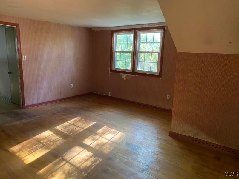 1029 Westgate Circle Bethlehem, PA 18017 - Photo 38 of 42 a view of an empty room with wooden floor and a window