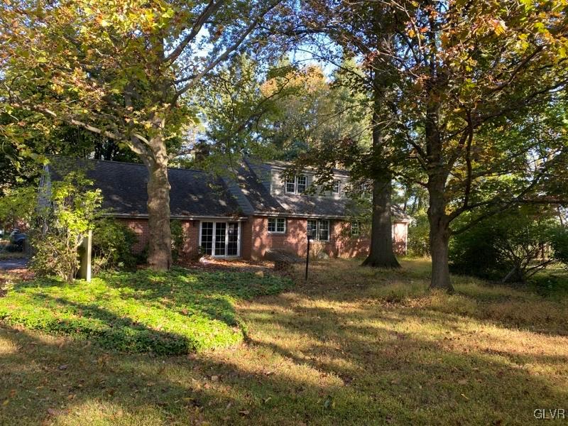 1029 Westgate Circle Bethlehem, PA 18017 - Photo 6 of 42 a view of a yard with plants and large trees