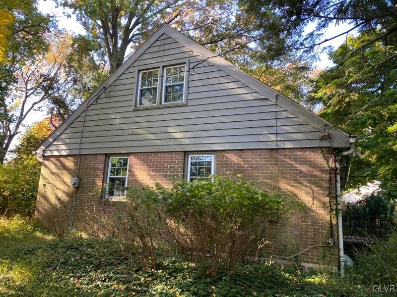 1029 Westgate Circle Bethlehem, PA 18017 - Photo 9 of 42 a backyard of a house with plants and trees