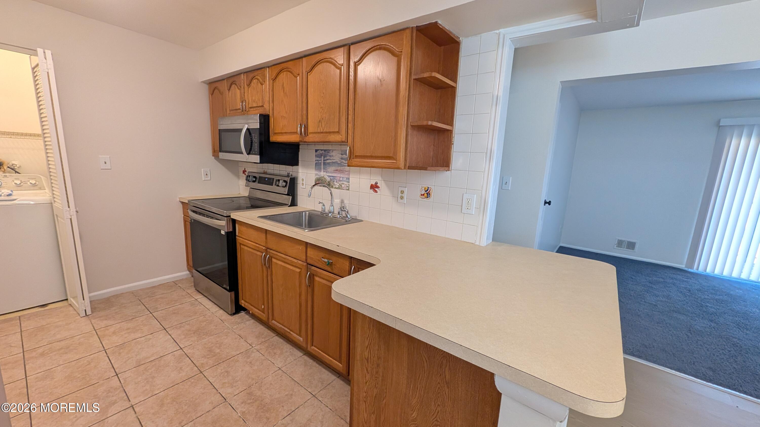 230 Sawmill Road, Unit A Brick, NJ 08724 - Photo 2 of 19 Kitchen and Laundry Closet