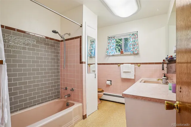 a bathroom with a bathtub and a sink