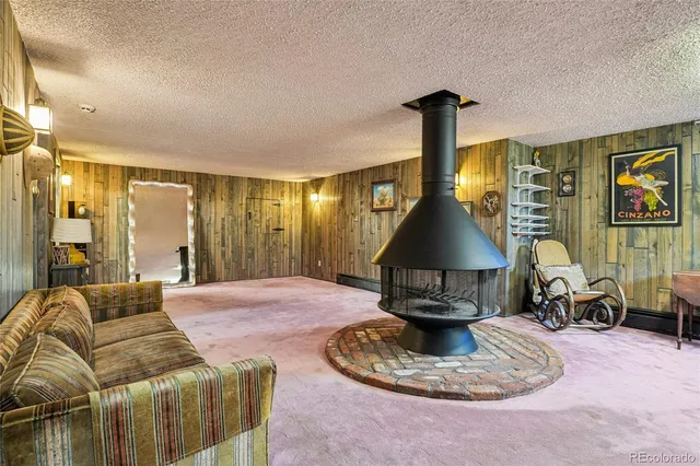 a living room with furniture and a lamp