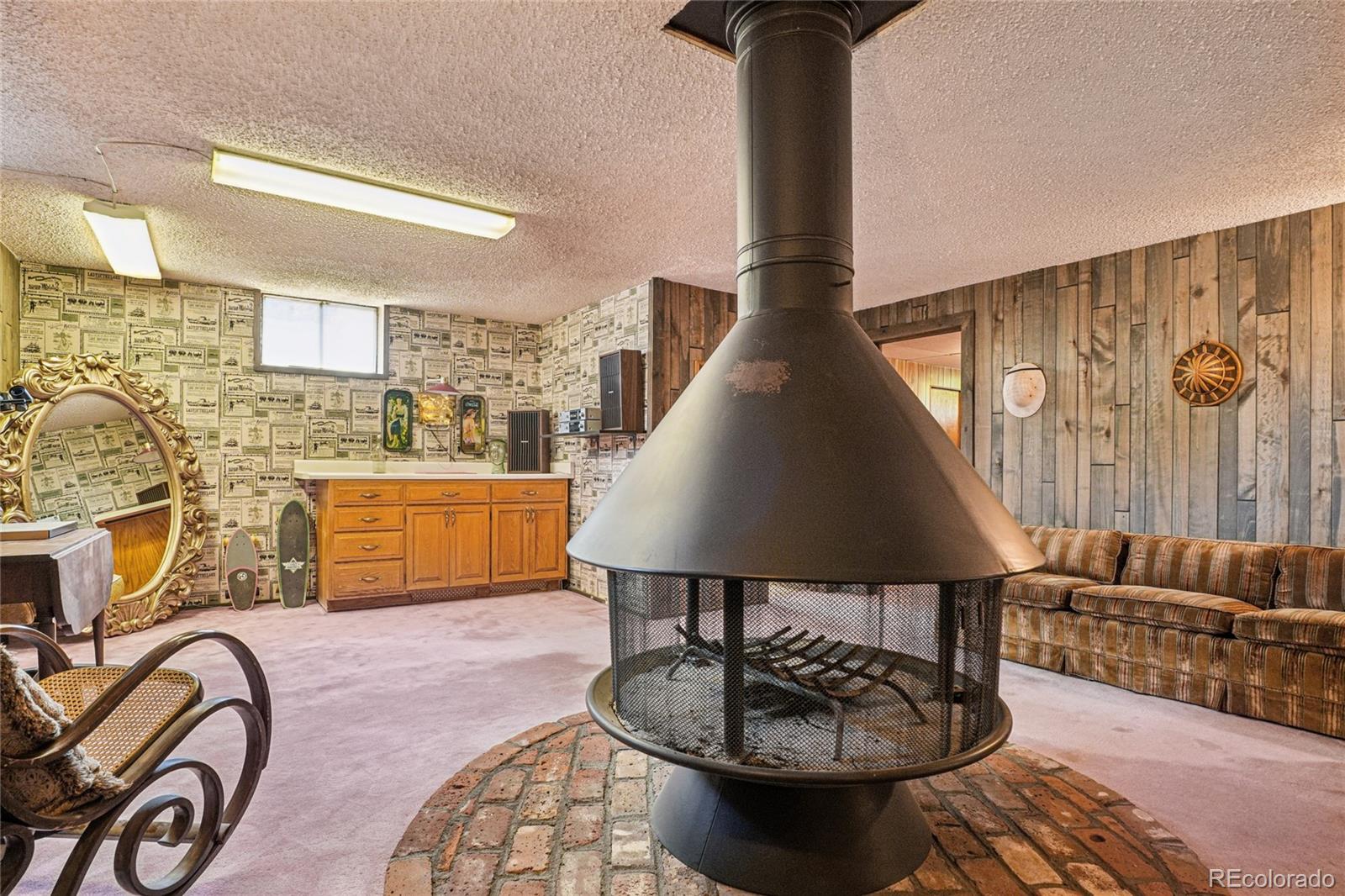 6920 West 47th Place Wheat Ridge, CO 80033 - Photo 26 of 43 a living room with furniture and a couch