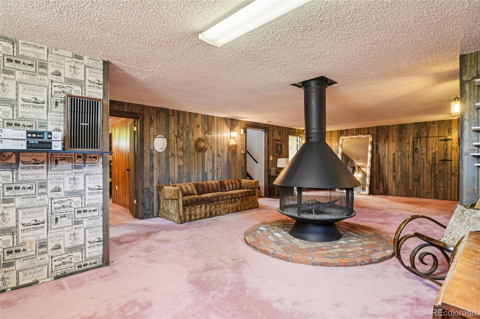 6920 West 47th Place Wheat Ridge, CO 80033 - Photo 27 of 43 a view of a lobby with furniture and a floor to ceiling window
