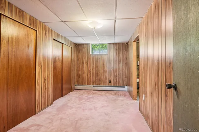 a view of a room with a wooden door