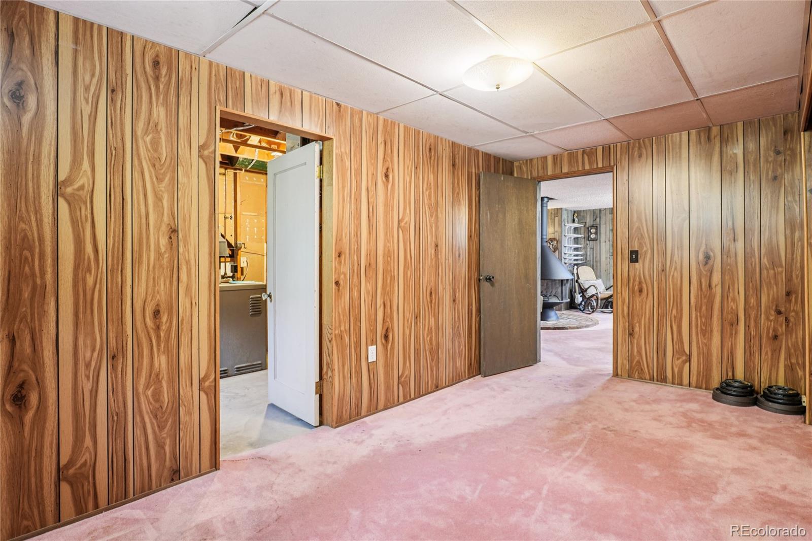6920 West 47th Place Wheat Ridge, CO 80033 - Photo 29 of 43 a view of a room with a wooden door