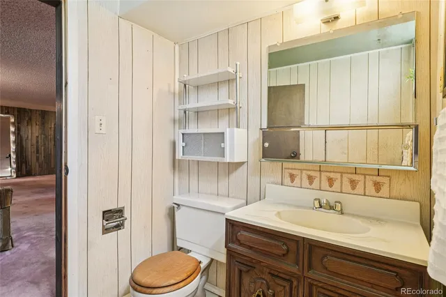 a view of a livingroom with furniture and a flat screen tv