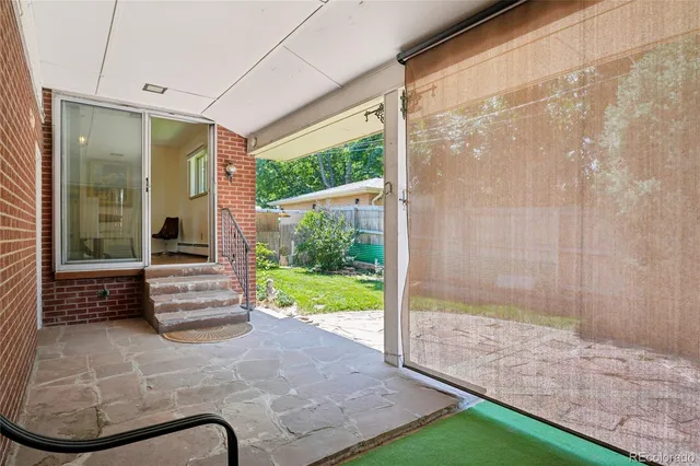 a front view of a house with a yard and fountain in middle