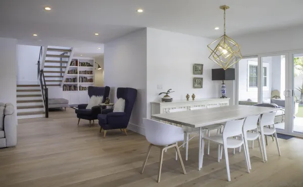 a view of a dining room with furniture wooden floor and chandelier