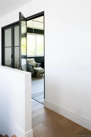 a view of a living room hardwood and a balcony