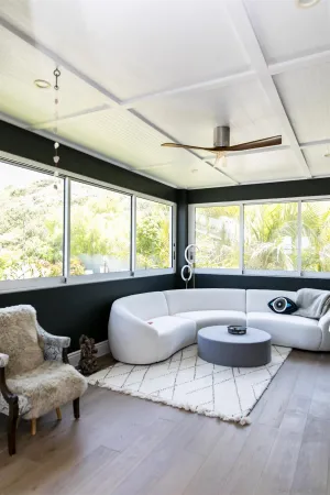 a living room with furniture and a large window