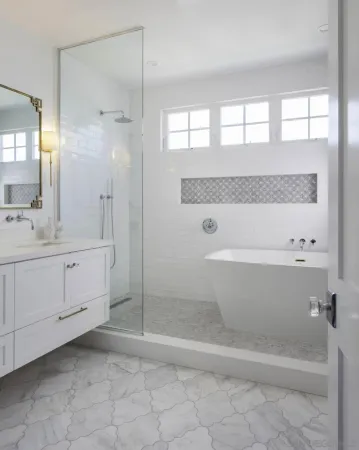 a bathroom with a granite countertop sink a mirror and a bathtub