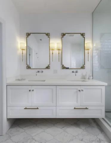 a bathroom with a sink vanity and mirror