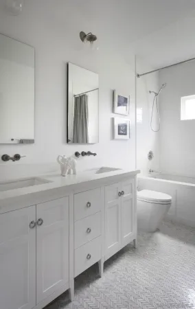 a spacious bathroom with a granite countertop sink a toilet a mirror and bathtub