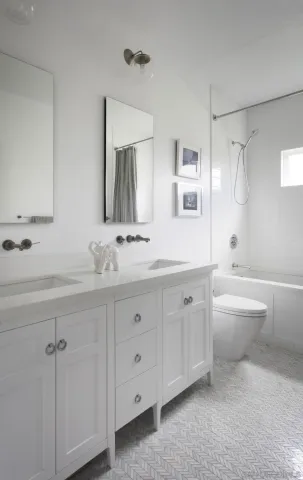 a spacious bathroom with a granite countertop sink a toilet a mirror and bathtub