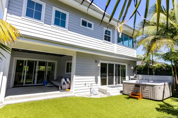 a view of a patio with table and chairs with wooden floor and fence