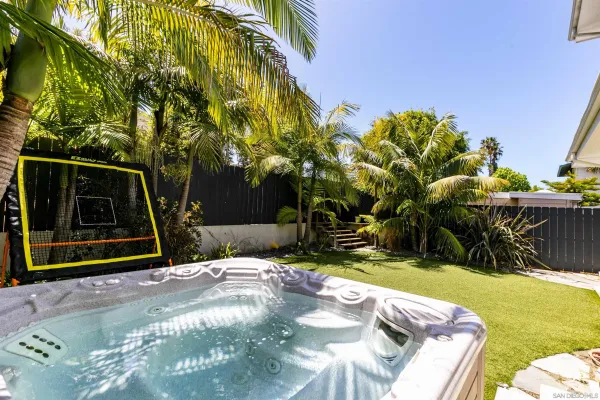 a view of a backyard with sitting area