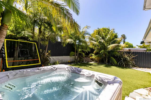 a view of a backyard with sitting area
