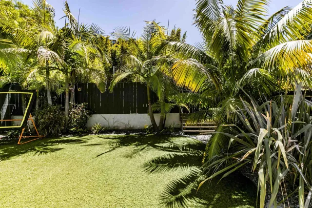 a view of swimming pool and trees in the background