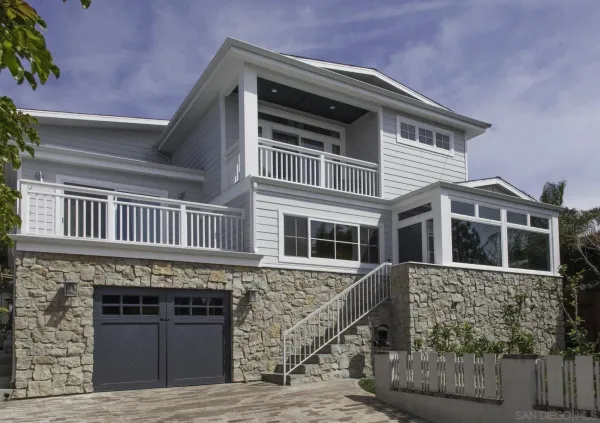 a front view of a house with a garage