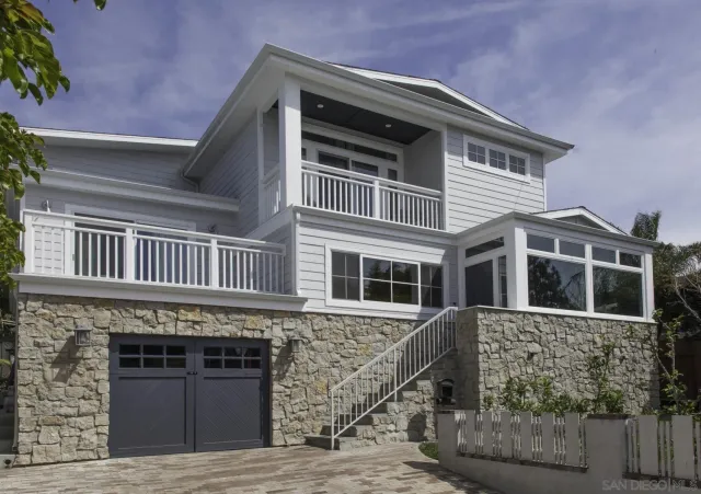 a front view of a house with a garage