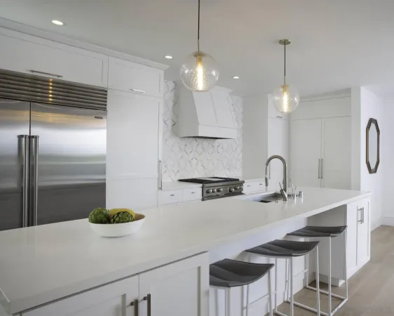 a kitchen with kitchen island a sink stainless steel appliances and cabinets