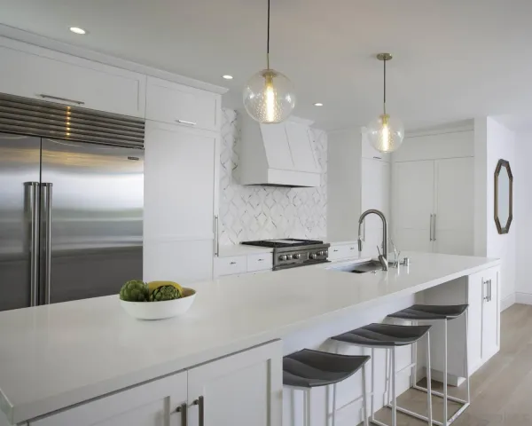 a kitchen with kitchen island a sink stainless steel appliances and cabinets