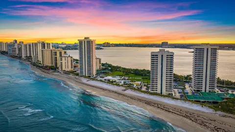 a kitchen with stainless steel appliances kitchen island granite countertop a sink and cabinets