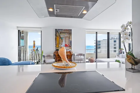 a bedroom with a bed a couch and painting on the wall