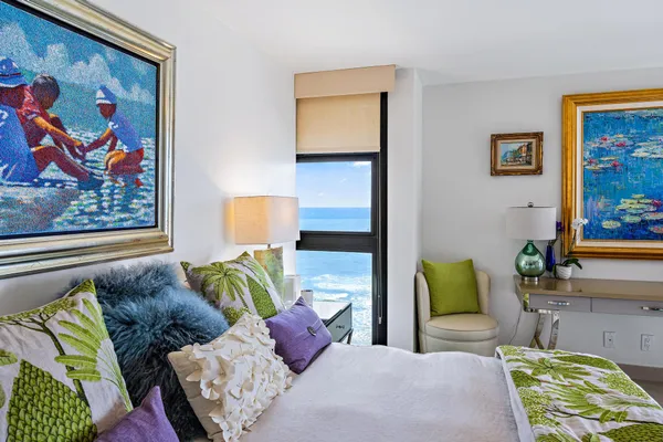 a bathroom with a tub a sink a mirror and a shower