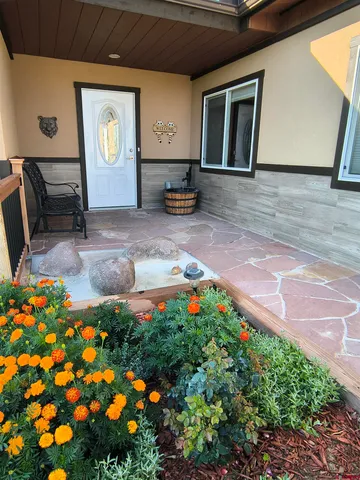 a front view of a house with garden