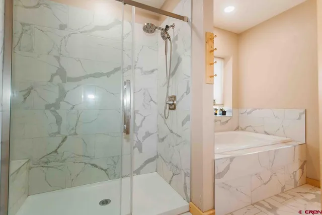 a bathroom with a sink and a shower