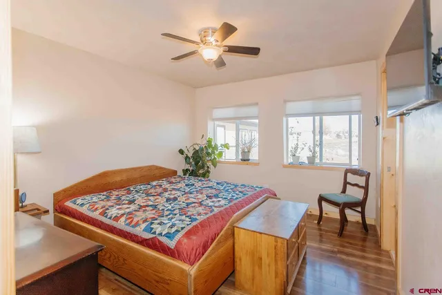 a living room with a rug and a table