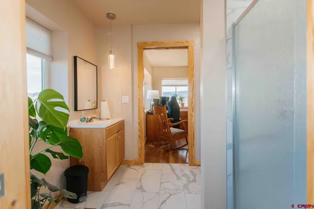 a view of a hallway with workspace