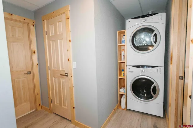 a utility room with sink dryer and washer