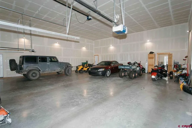 a view of a garage with cars