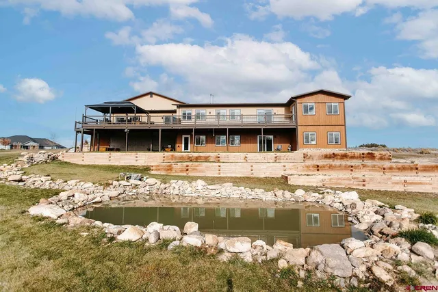 a front view of a building with lake view