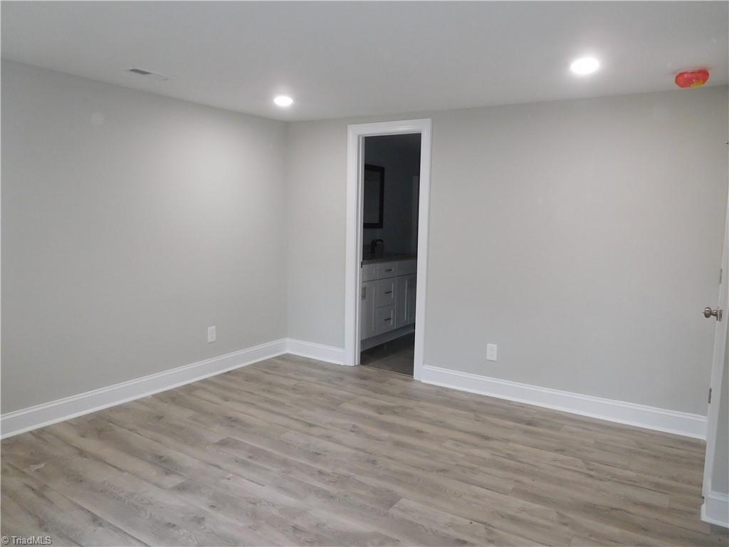 1324 Motor Road Winston-Salem, NC 27105 - Photo 14 of 27 Primary Bedroom. New Flooring continues. Double Door Closet.