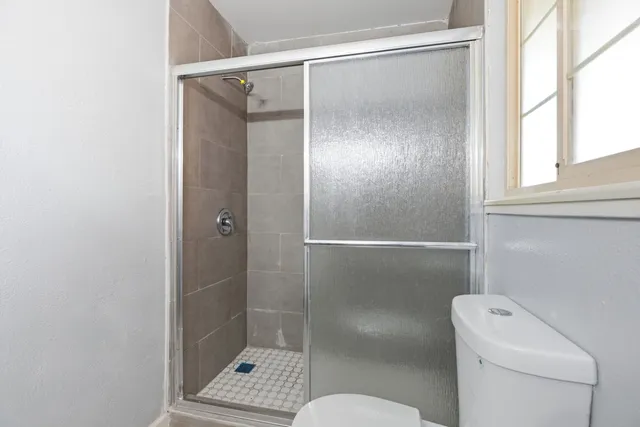 a view of storage and utility room with closet