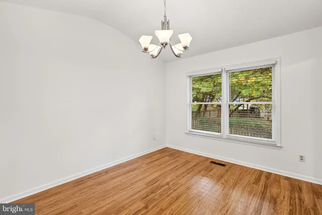 a kitchen with stainless steel appliances granite countertop a stove and a refrigerator
