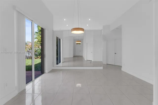 a kitchen with stainless steel appliances a sink stove and refrigerator