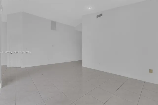 a view of empty room with windows