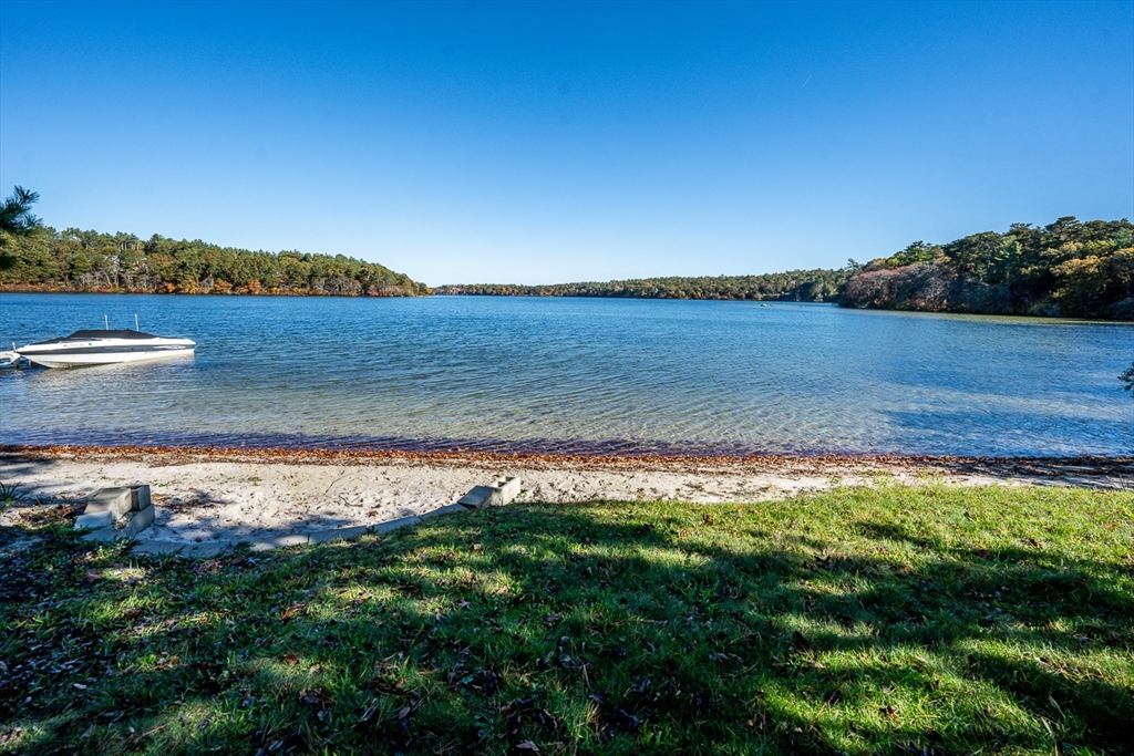 215 Roxy Cahoon Road Plymouth, MA 02360 - Photo 36 of 40 a view of a lake with a big yard