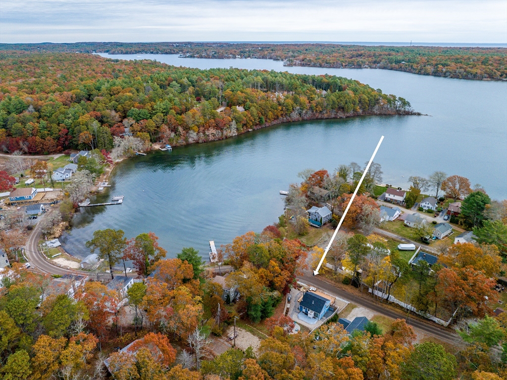 215 Roxy Cahoon Road Plymouth, MA 02360 - Photo 38 of 40 a view of a lake with a mountain in the background