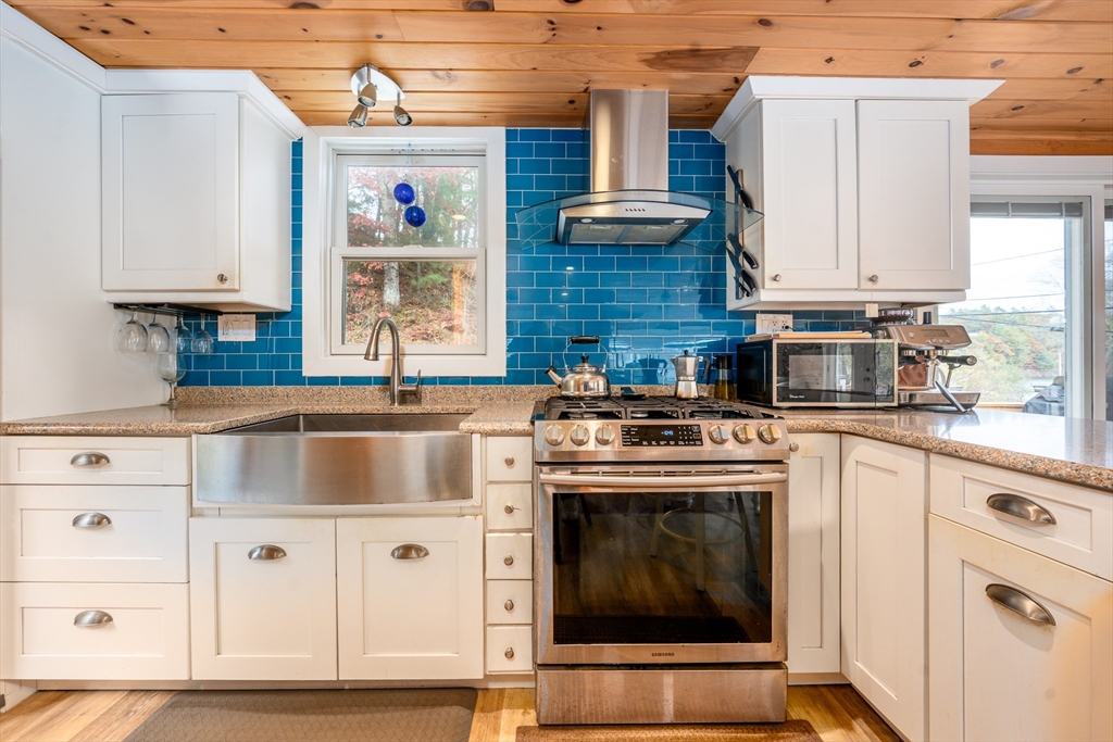215 Roxy Cahoon Road Plymouth, MA 02360 - Photo 10 of 40 a kitchen with stainless steel appliances granite countertop a stove and a sink