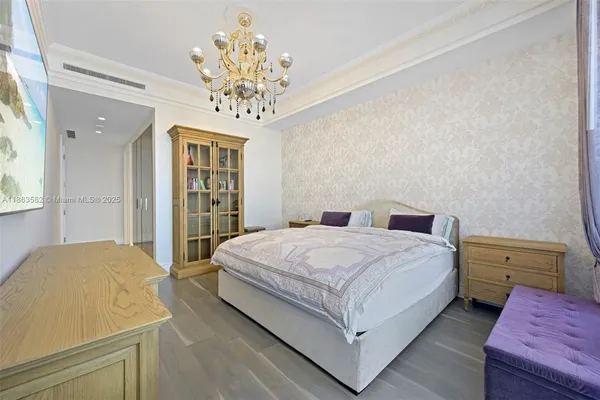 a spacious bedroom with a bed and a table