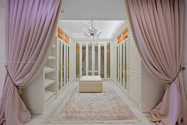 a bathroom with a sink and mirror with toilet